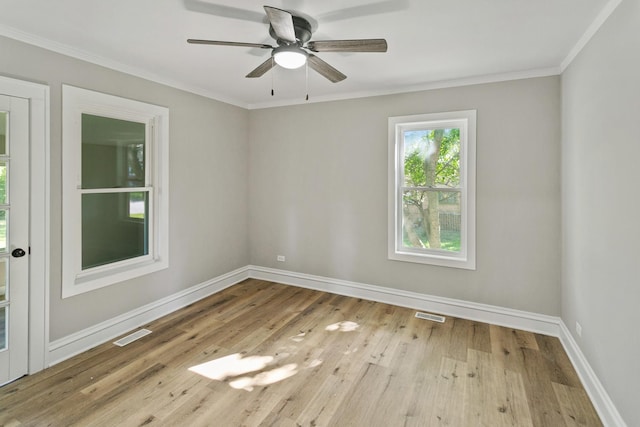 spare room with ceiling fan, light wood-type flooring, and ornamental molding