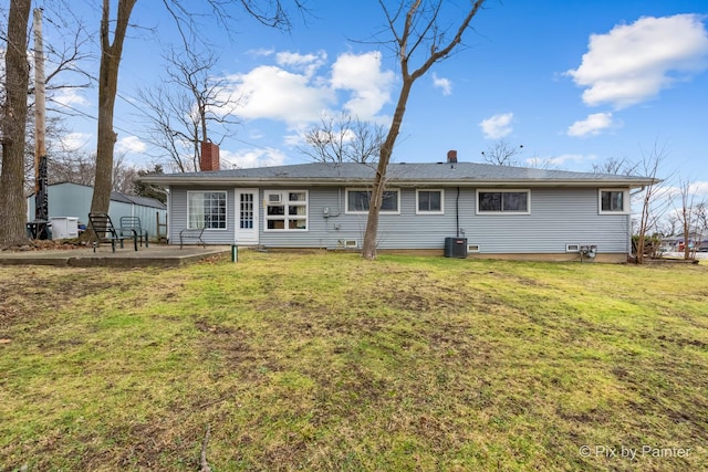 back of house with a lawn, a patio area, and central AC unit