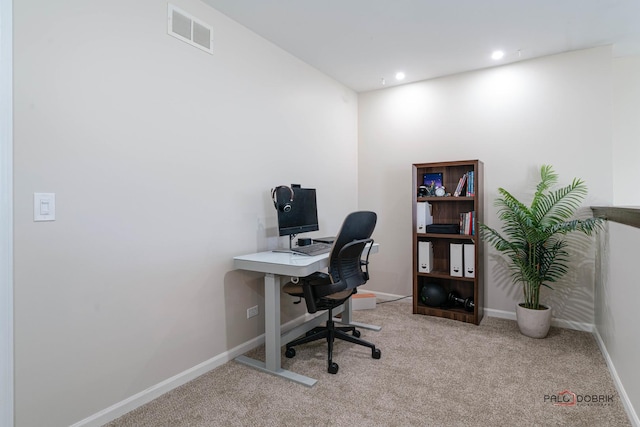 home office featuring light colored carpet