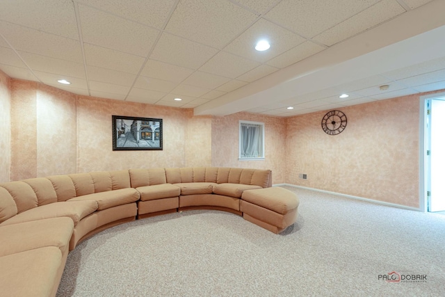 unfurnished living room featuring a drop ceiling and carpet floors