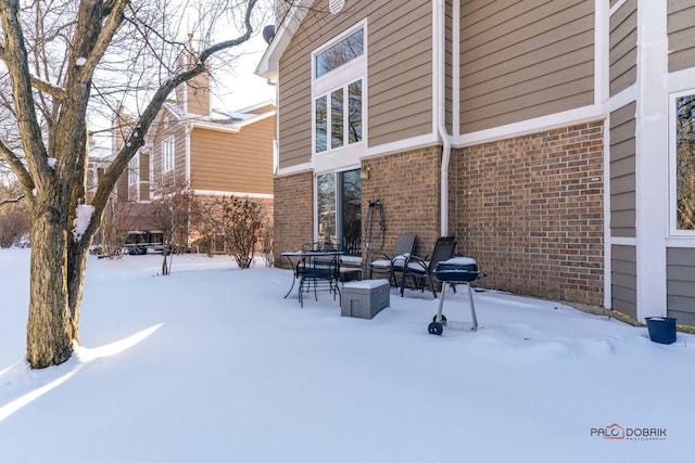 view of snow covered patio