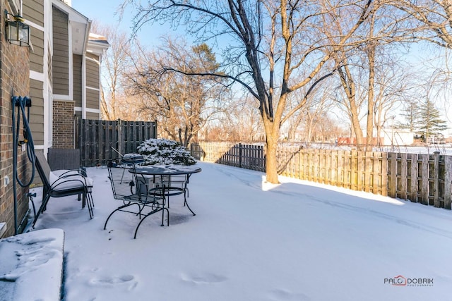 view of snow covered patio