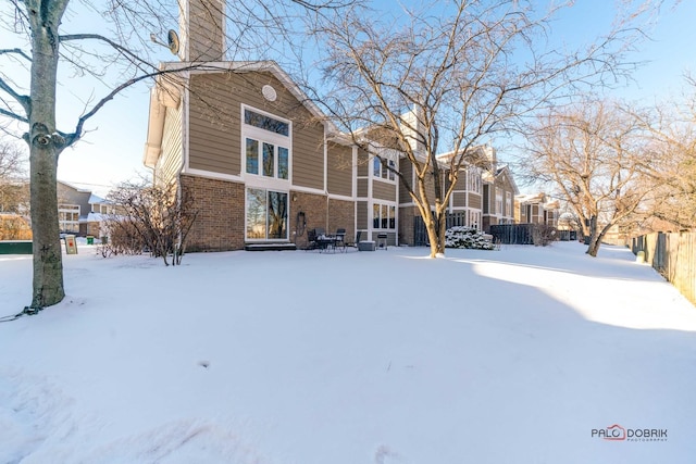 view of snow covered house