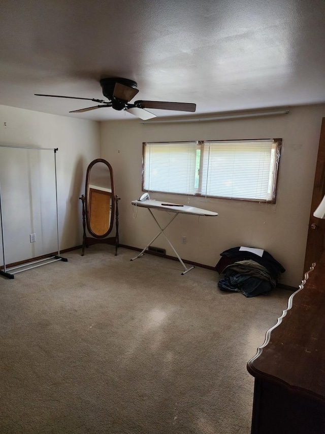 interior space featuring ceiling fan and a healthy amount of sunlight