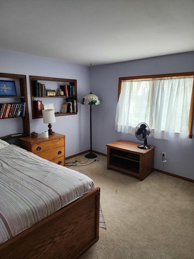 bedroom with light colored carpet