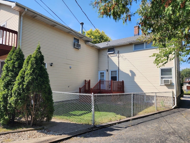 view of home's exterior with a lawn and cooling unit