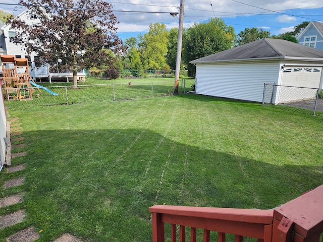 view of yard with a playground and a garage