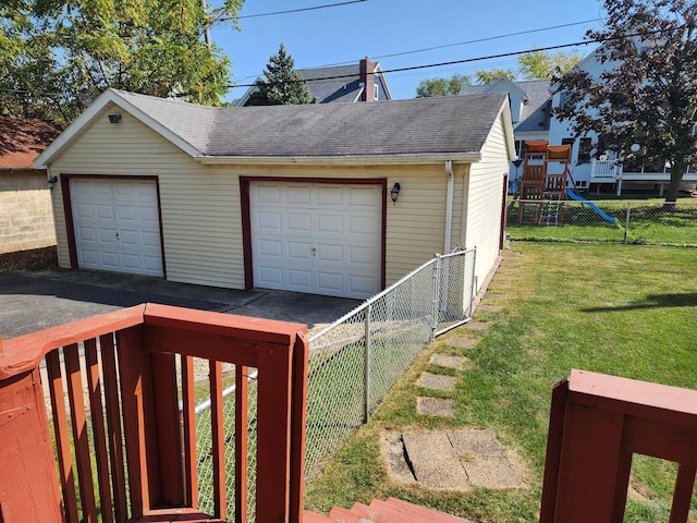 garage featuring a lawn