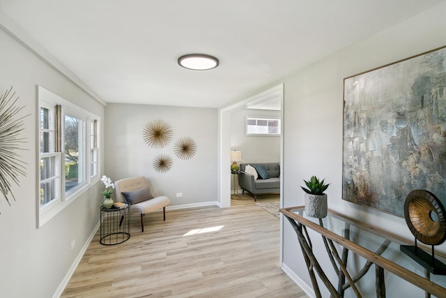 sitting room featuring light hardwood / wood-style floors