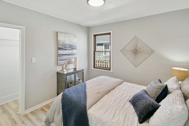 bedroom with light hardwood / wood-style flooring