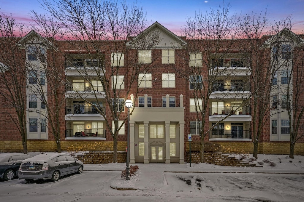 view of outdoor building at dusk