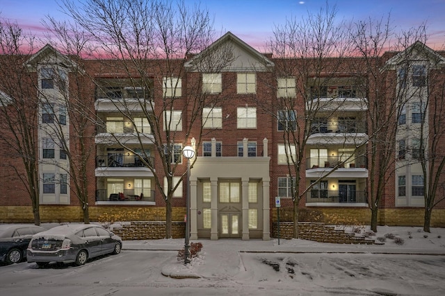 view of outdoor building at dusk