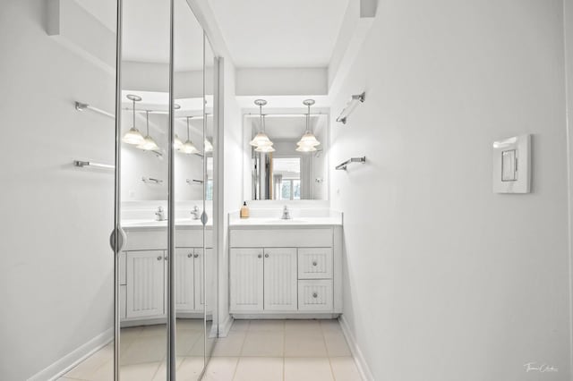 bathroom with vanity and tile patterned floors