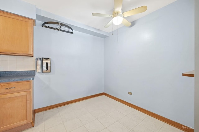 unfurnished room featuring ceiling fan