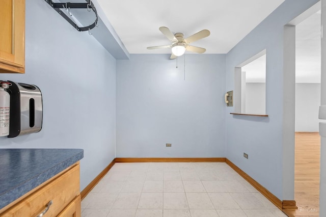 interior space featuring ceiling fan