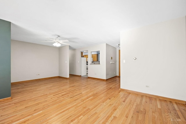 unfurnished living room with ceiling fan and light wood-type flooring