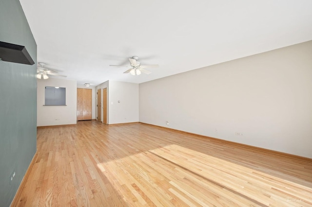 unfurnished living room with light hardwood / wood-style floors and ceiling fan