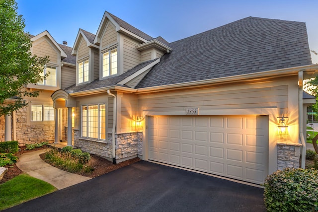 view of front of property with a garage