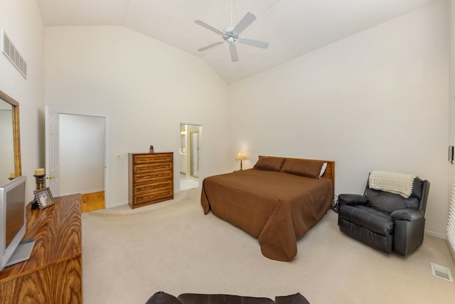 bedroom featuring light colored carpet, ceiling fan, lofted ceiling, and ensuite bathroom