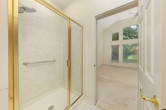 bathroom featuring tile patterned floors, ceiling fan, and a shower with door