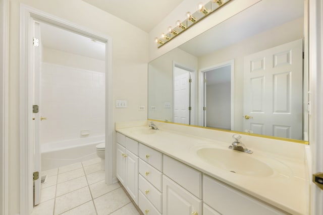 bathroom with tile patterned flooring, vanity, and toilet