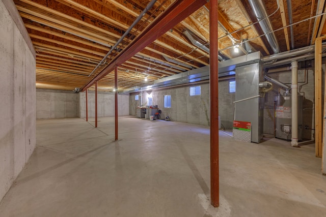 basement with heating unit and water heater