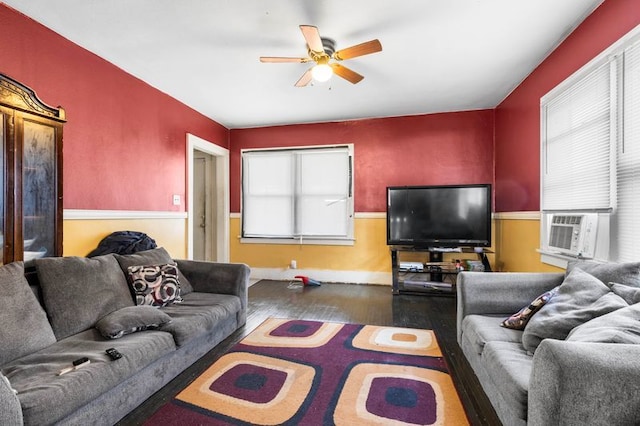 living room with ceiling fan, cooling unit, and dark hardwood / wood-style floors