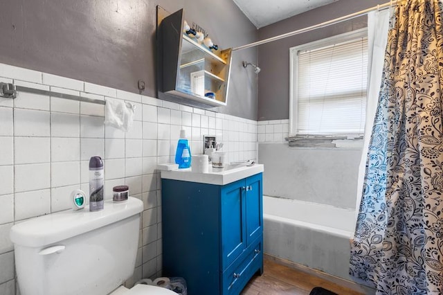 bathroom featuring shower / bath combo and toilet