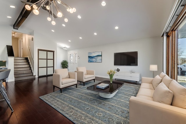 living room featuring vaulted ceiling with beams, dark hardwood / wood-style floors, and an inviting chandelier