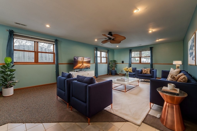 living room with ceiling fan and light tile patterned floors