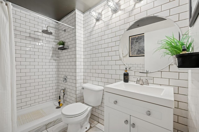 bathroom with curtained shower, toilet, decorative backsplash, vanity, and tile walls