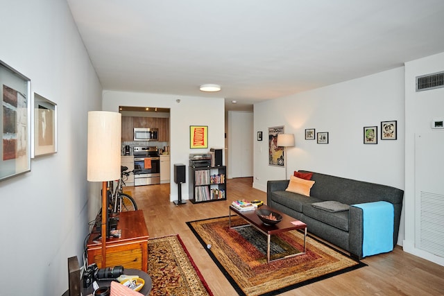 living room with light hardwood / wood-style floors