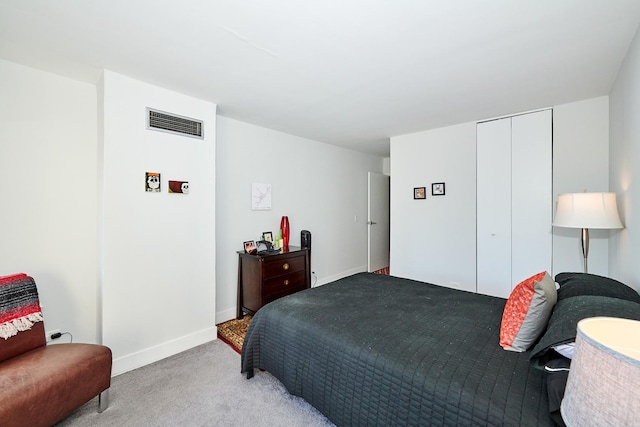 carpeted bedroom with a closet