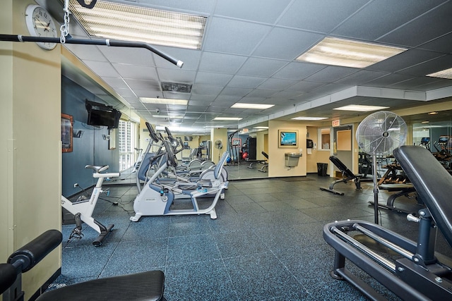 exercise room featuring a paneled ceiling