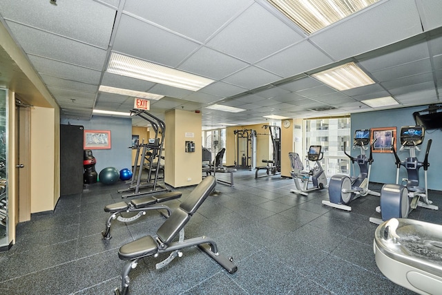 gym featuring a drop ceiling