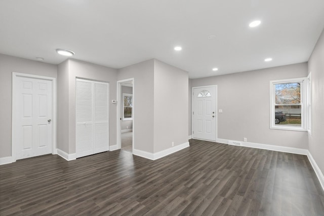 interior space with dark hardwood / wood-style floors