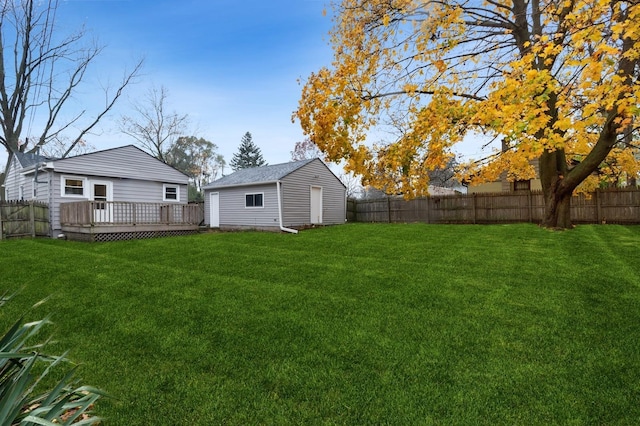 view of yard with an outdoor structure and a deck