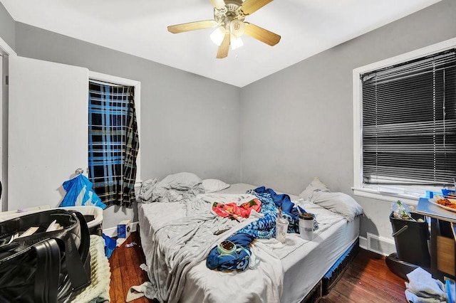 bedroom featuring dark hardwood / wood-style floors and ceiling fan