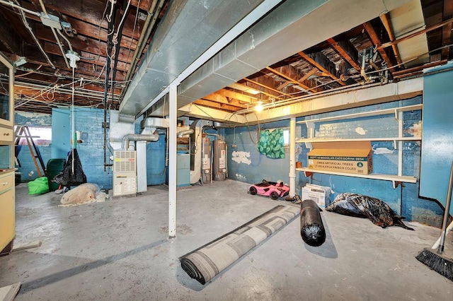 basement with heating unit and water heater