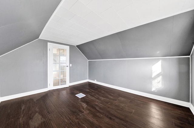 bonus room featuring hardwood / wood-style flooring and lofted ceiling