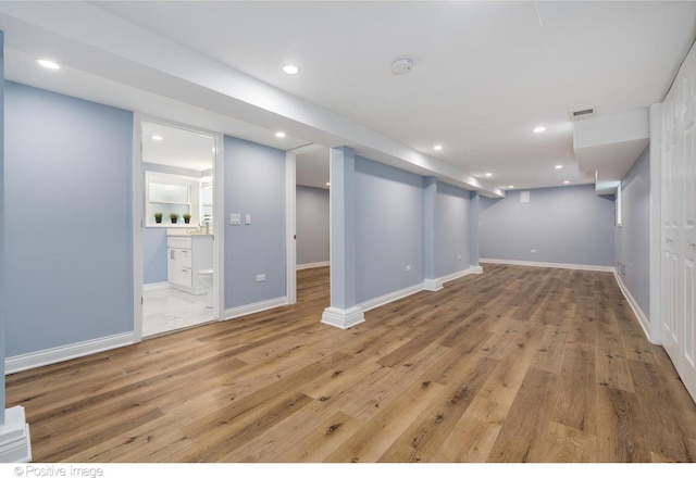 basement featuring light hardwood / wood-style flooring