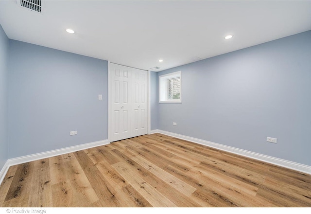 spare room featuring light wood-type flooring