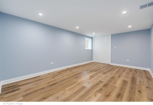 spare room featuring light hardwood / wood-style floors