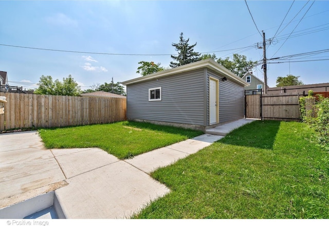 view of yard featuring a patio and an outdoor structure