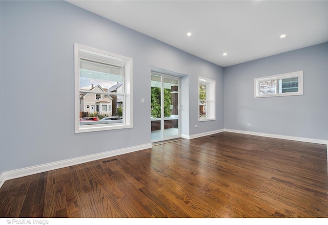 unfurnished room featuring dark hardwood / wood-style flooring