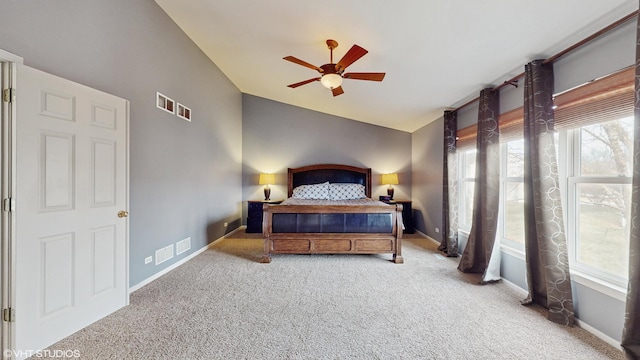 carpeted bedroom featuring ceiling fan and lofted ceiling