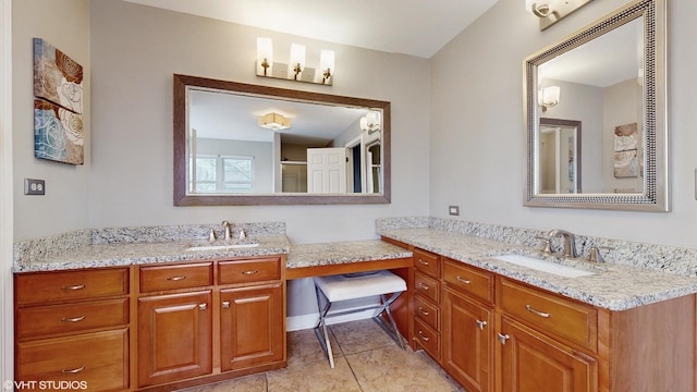 bathroom with tile patterned flooring and vanity