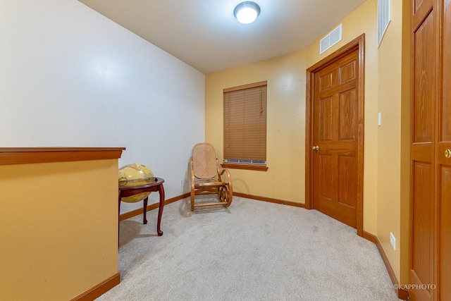 living area featuring light colored carpet