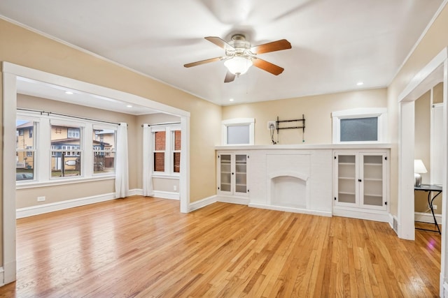 unfurnished living room with ceiling fan and light hardwood / wood-style floors