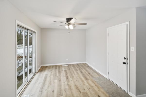 unfurnished room featuring ceiling fan and light hardwood / wood-style flooring